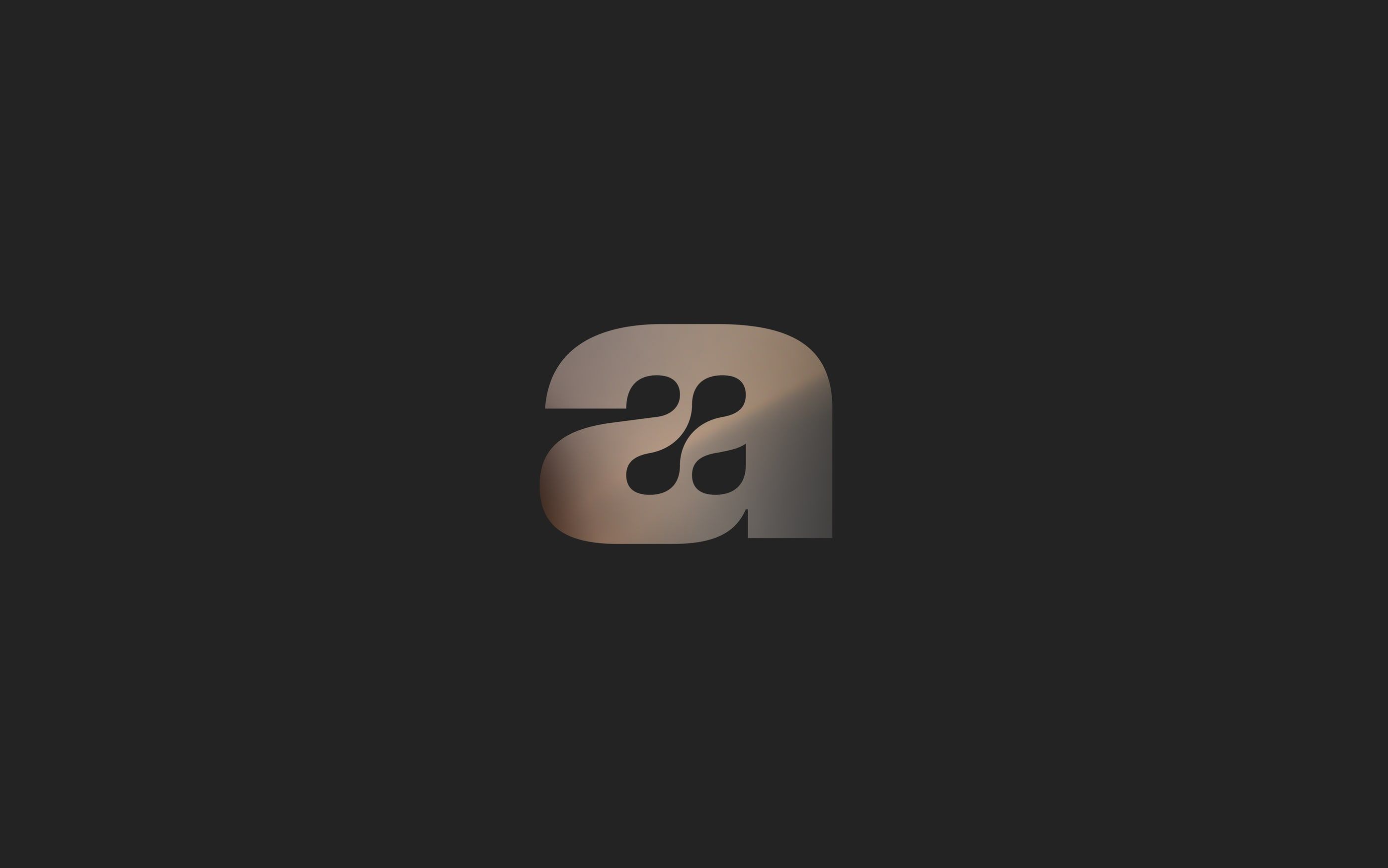 metallic maru symbol on a dark background