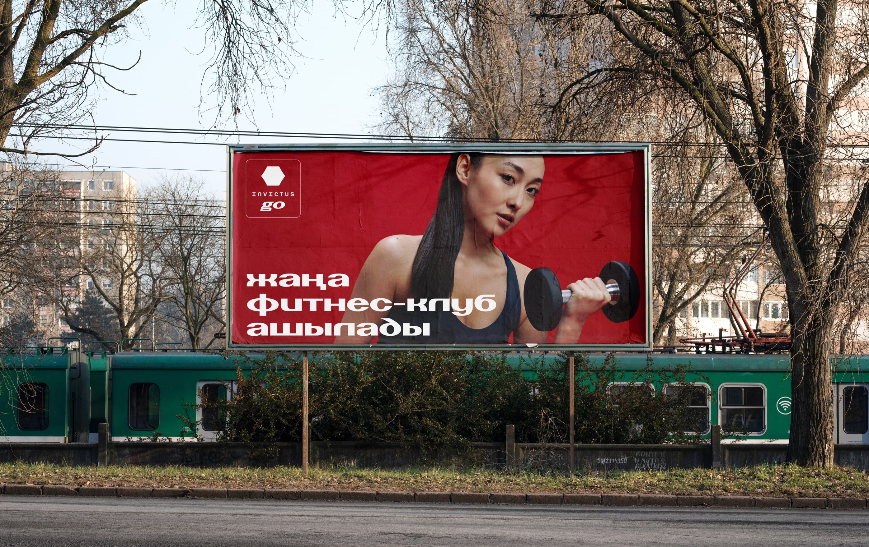 red nvcts billboard above a city railway